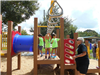 Kids on the monkey bars and play equipment