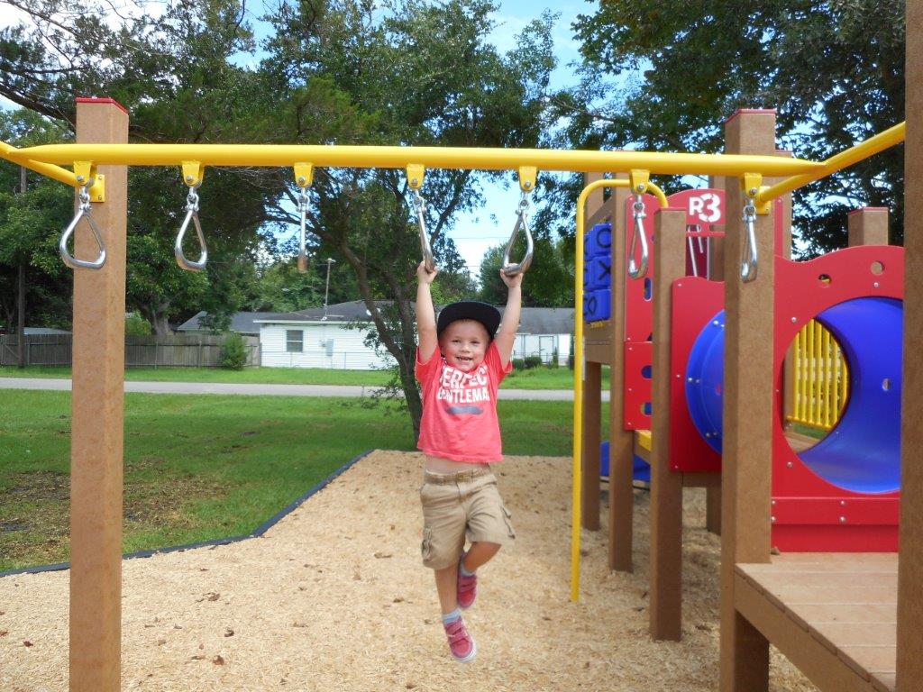 Boy on the monkey bars