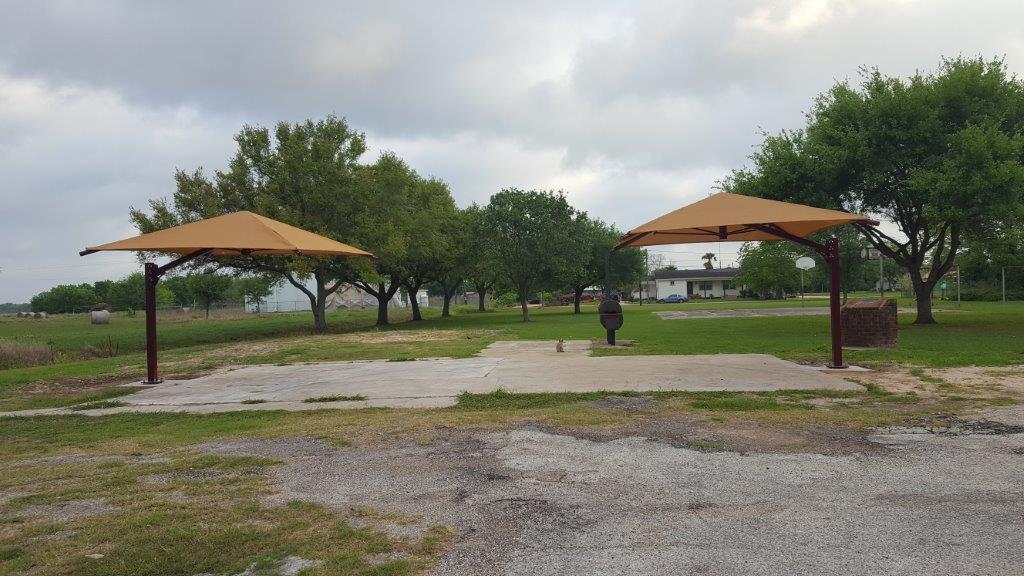 Two canopies by grill