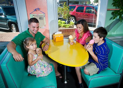Family Having Ice Cream in a Booth